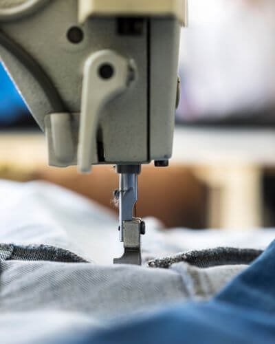 Denim apparel on sewing machine